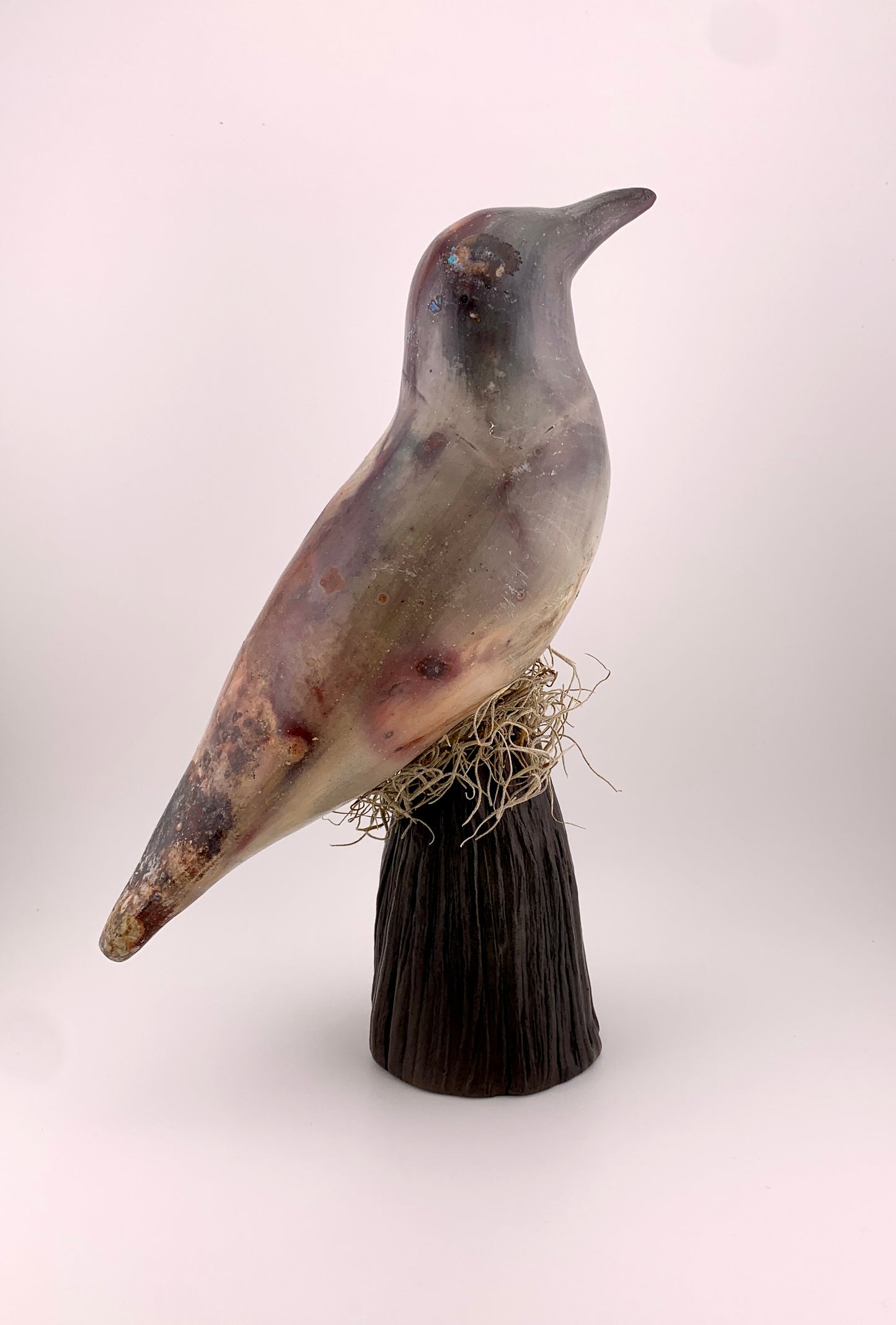 Ceramic Bird barrel fired on a stand
